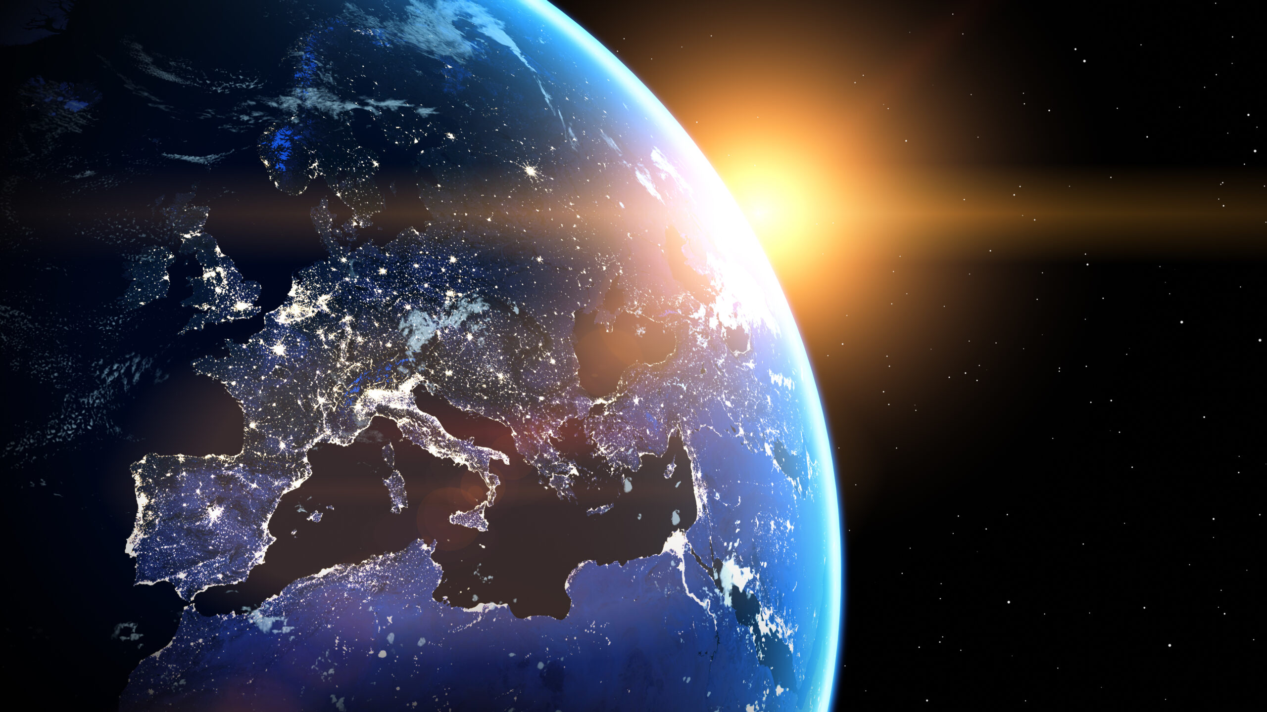 Planet Earth viewed from space with glowing city lights. Europe view.  World with shine sunrise from the space.