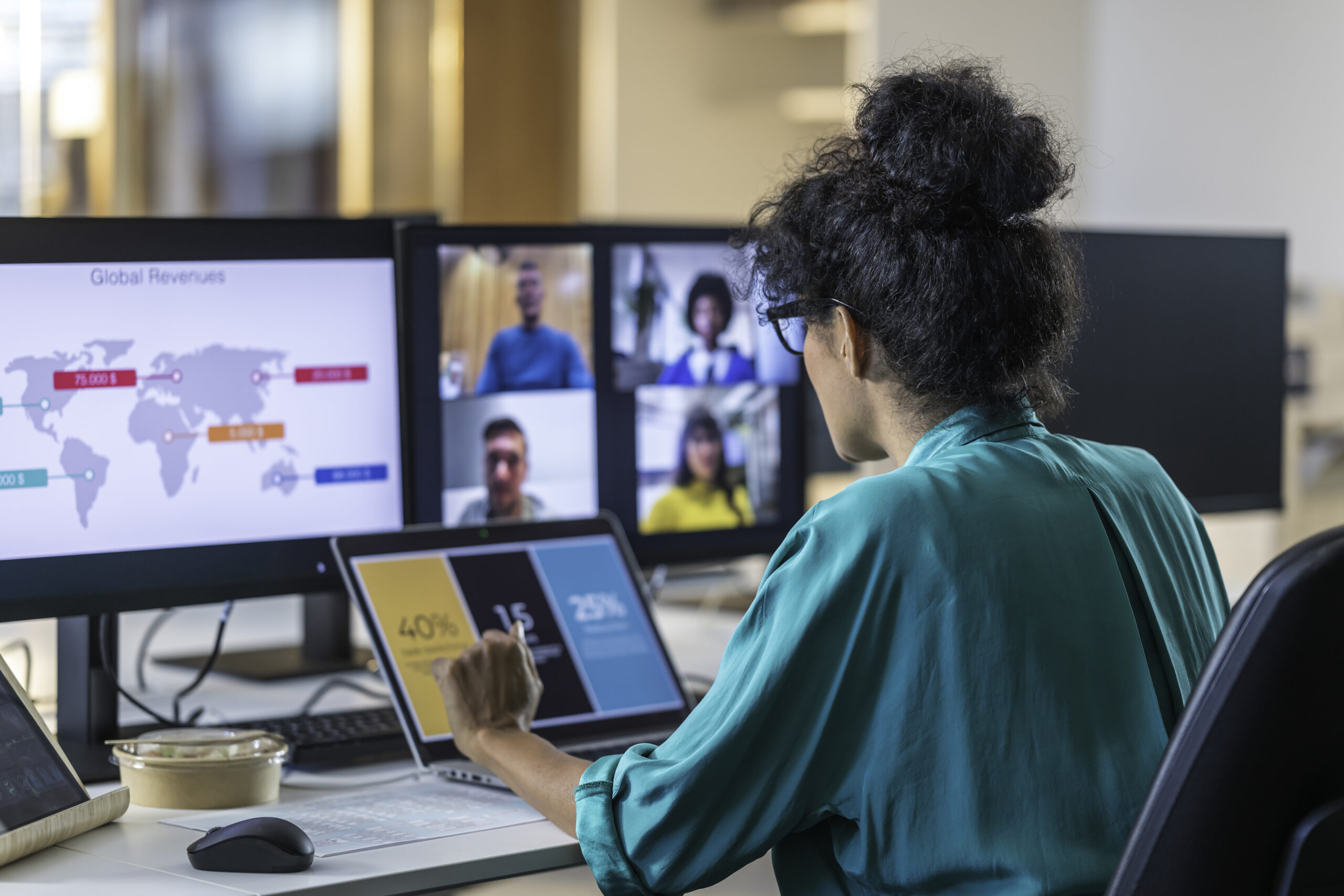 Businesswoman with colleagues during conference call